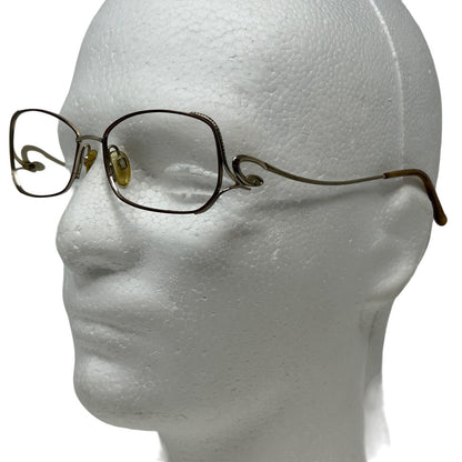 Sophia Loren Eyeglasses in gold with rectangular frames, side view showcasing the unique design
