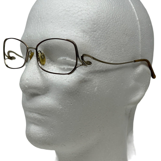 Sophia Loren Eyeglasses in gold with rectangular frames, side view showcasing the unique design