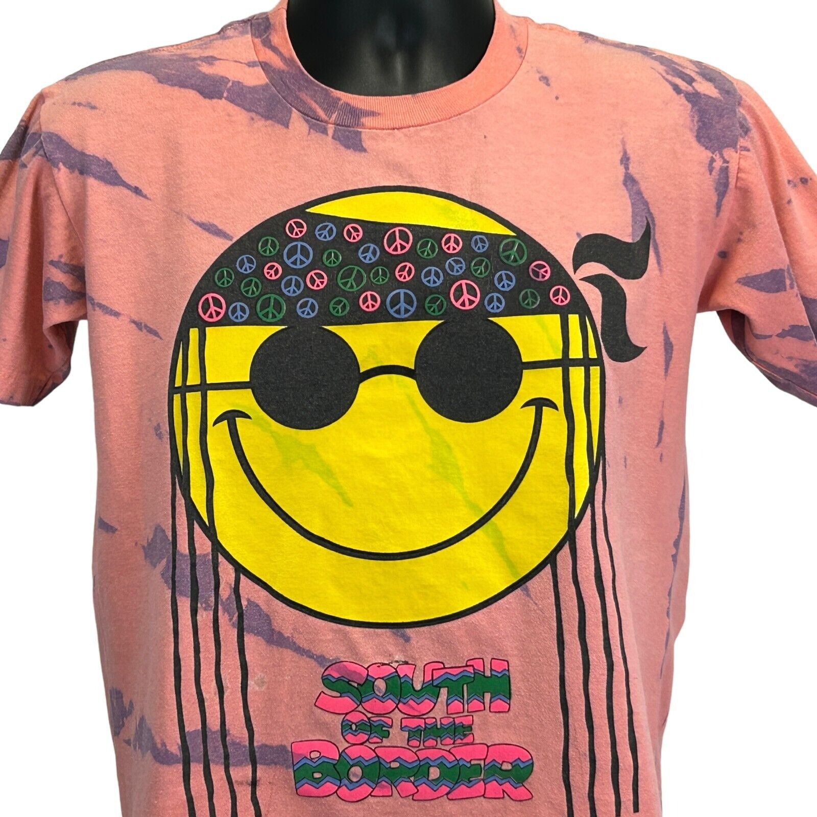 South of the Border orange tie-dye T-shirt featuring a smiley face and peace sign design, front view