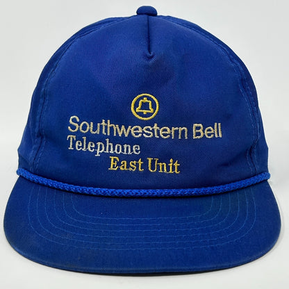 Front view of a vintage hat in blue with Southwestern Bell logo and text in yellow detailing
