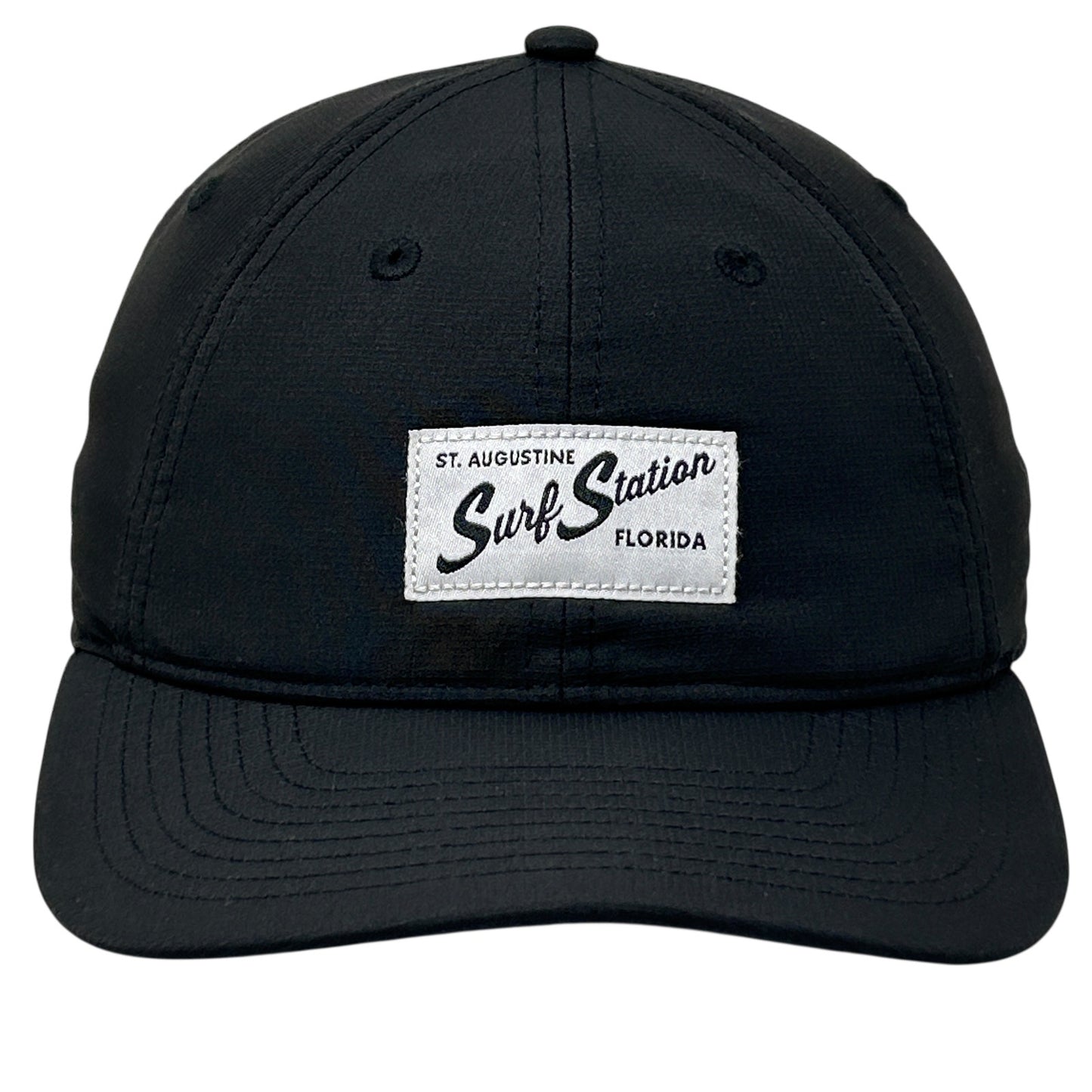 Black adjustable Surf Station cap with front logo patch from St. Augustine, Florida