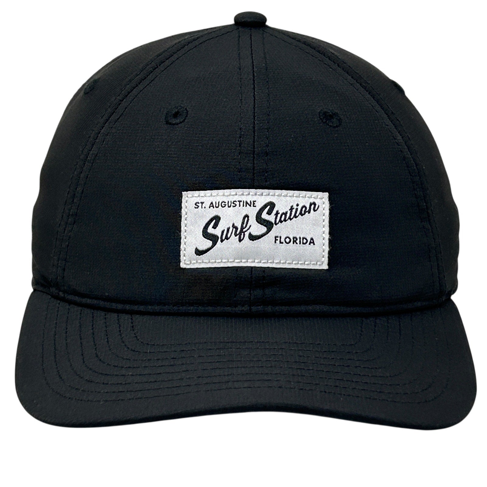 Black adjustable Surf Station cap with front logo patch from St. Augustine, Florida