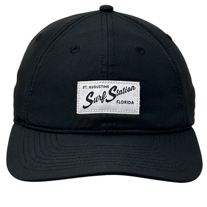 Black adjustable Surf Station cap with front logo patch from St. Augustine, Florida