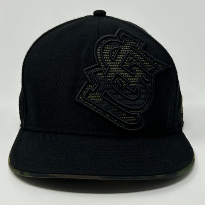 Front view of a black New Era St Louis Cardinals Hat featuring a raised logo and camo brim