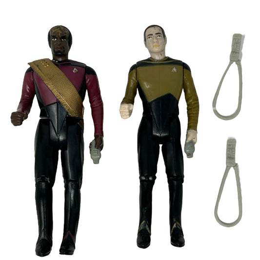 Star Trek action figures featuring a black and gold uniformed character and a burgundy uniformed character
