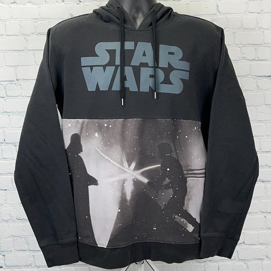 Star Wars hoodie black front view size medium with iconic lightsaber battle design