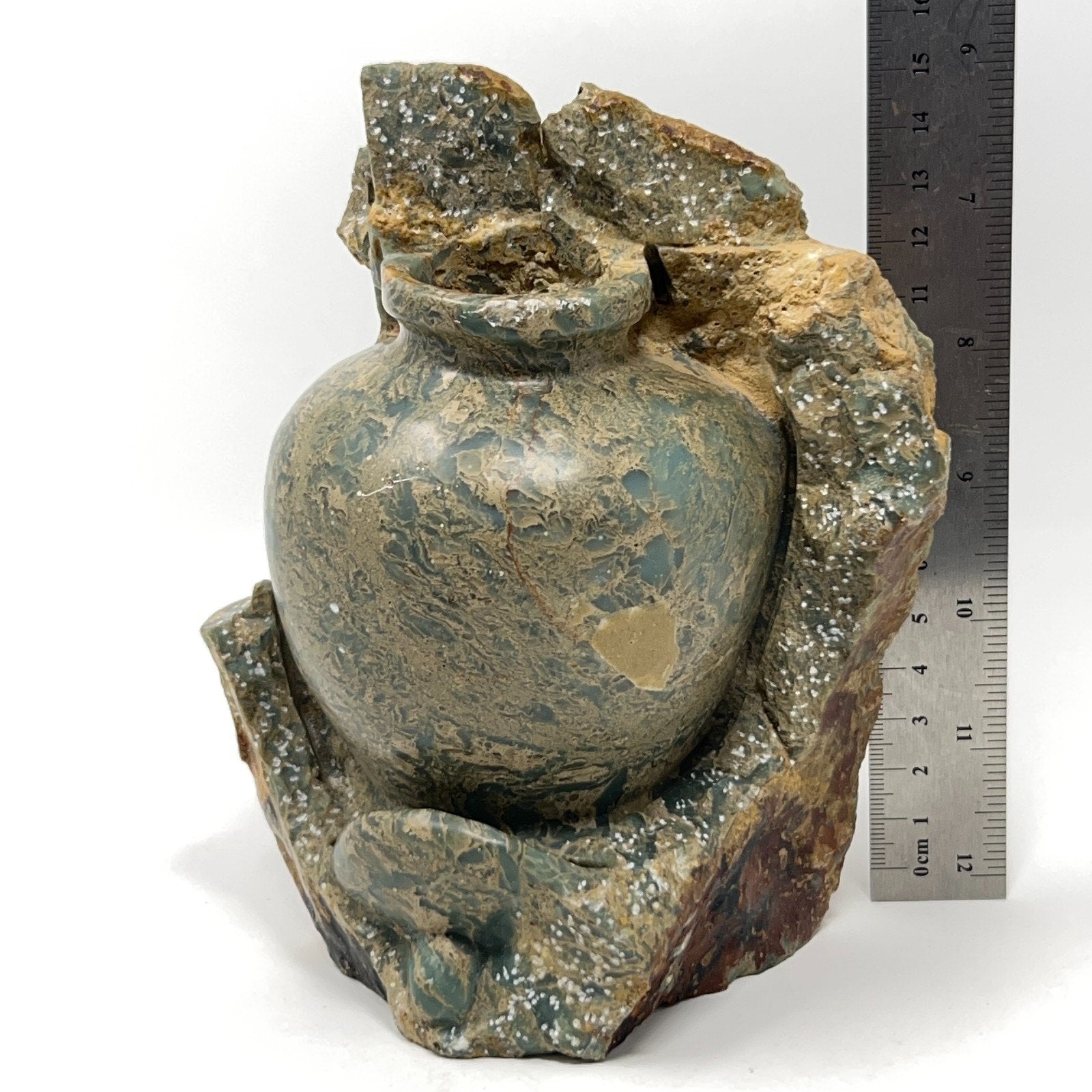 Unbranded vintage stone vase in green with textured design and natural stone base