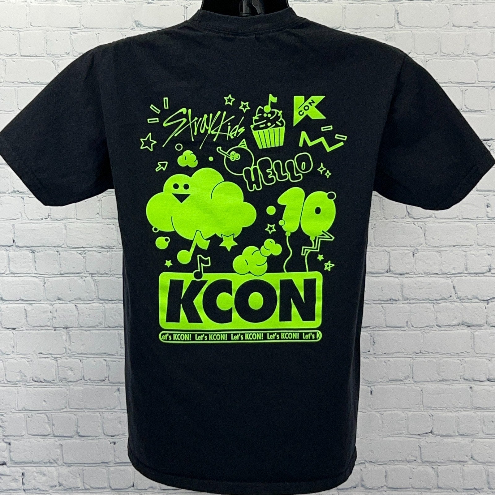 Black Gildan KCON T-shirt for men with neon green graphic print on back featuring playful designs