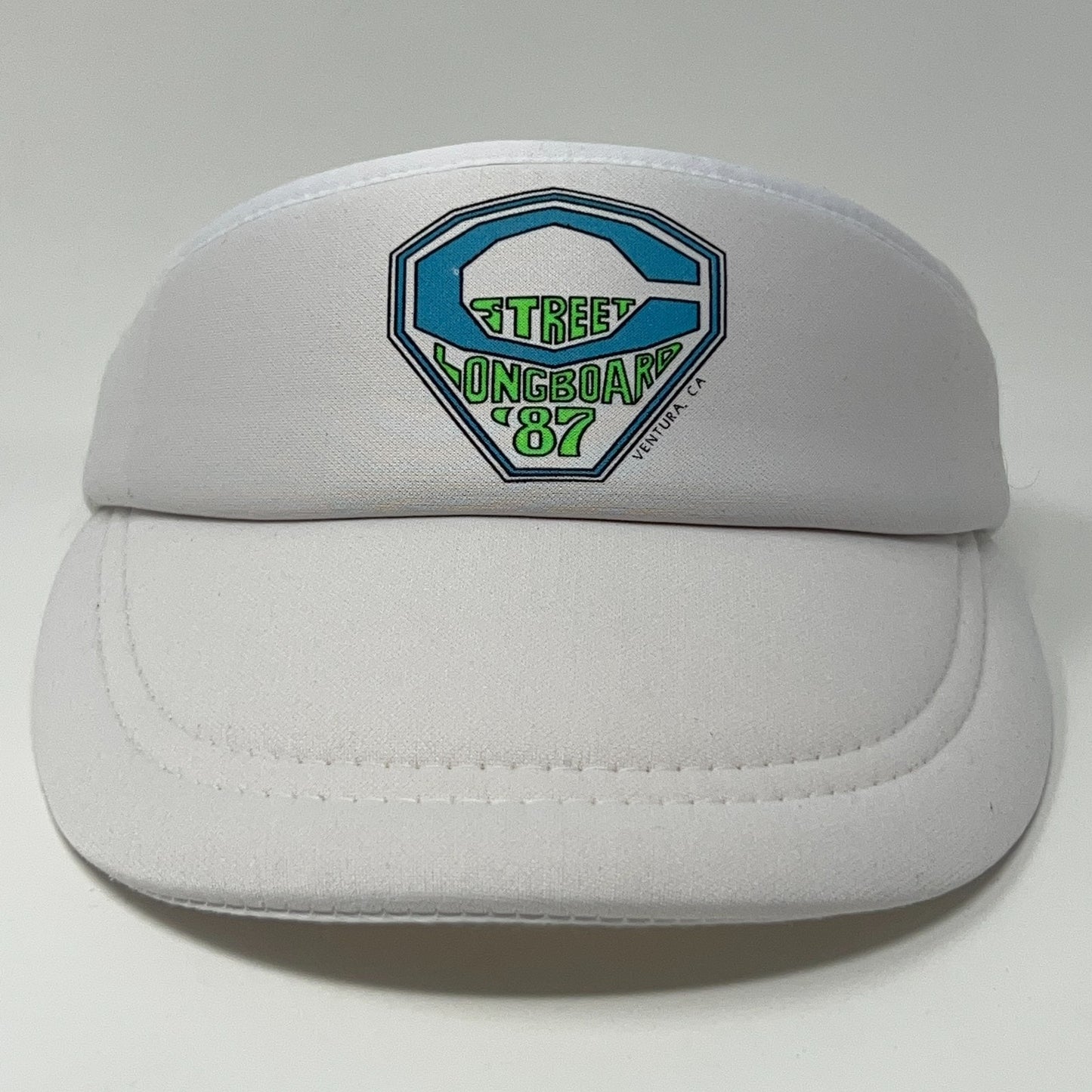 Front view of the Vintage Surfing Visor in white with colorful logo for Street Longboard '87