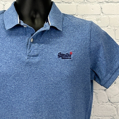 Front view of a blue Superdry Polo shirt with logo detail on the chest