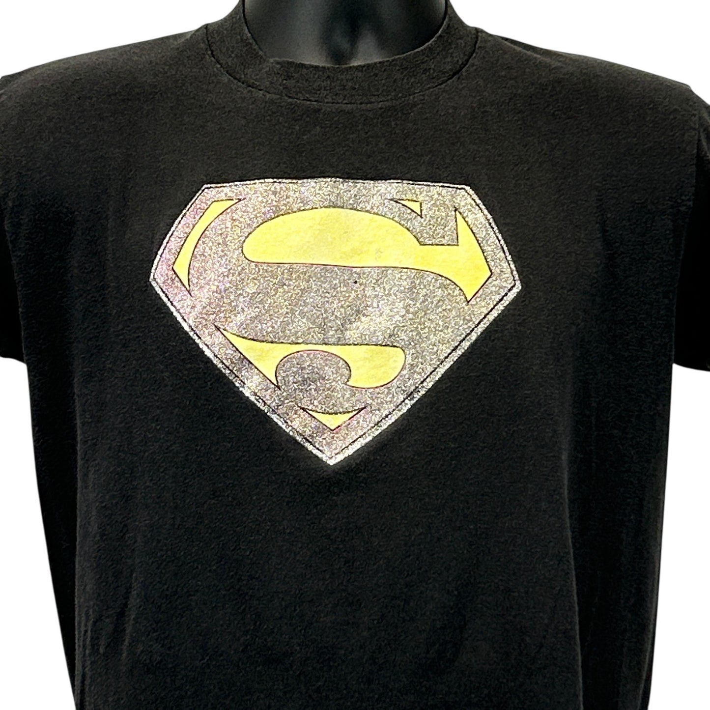 Front view of Vintage Superman T-Shirt in black with a detailed glitter logo design