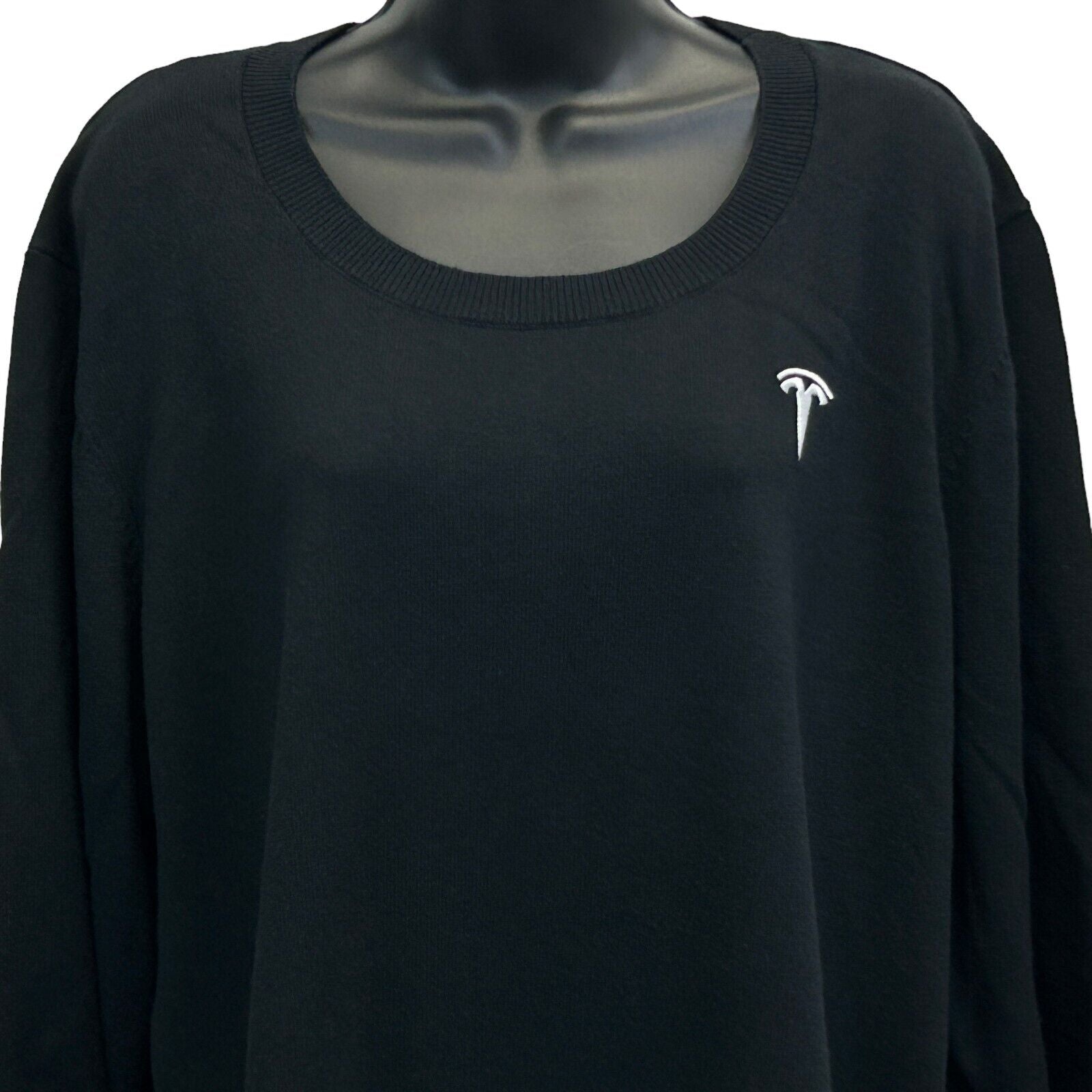 Front view of a black Tesla sweater featuring the Tesla logo in white at the chest