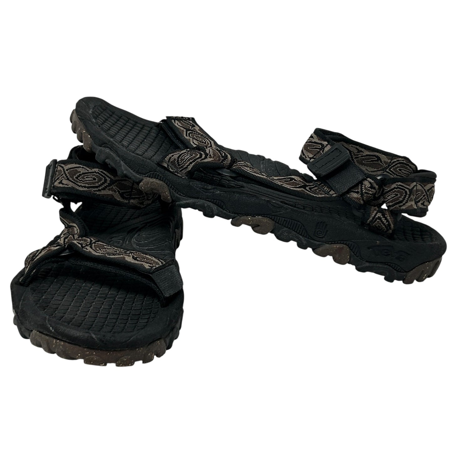 Teva Sandals in black with patterned straps, showcasing a front view and rugged sole for durability.