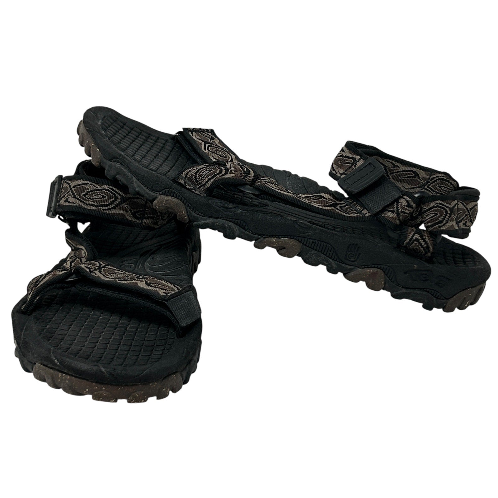 Teva Sandals in black with patterned straps, showcasing a front view and rugged sole for durability.