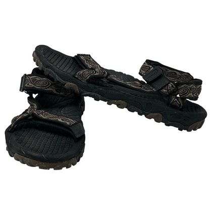 Teva Sandals in black with patterned straps, showcasing a front view and rugged sole for durability.
