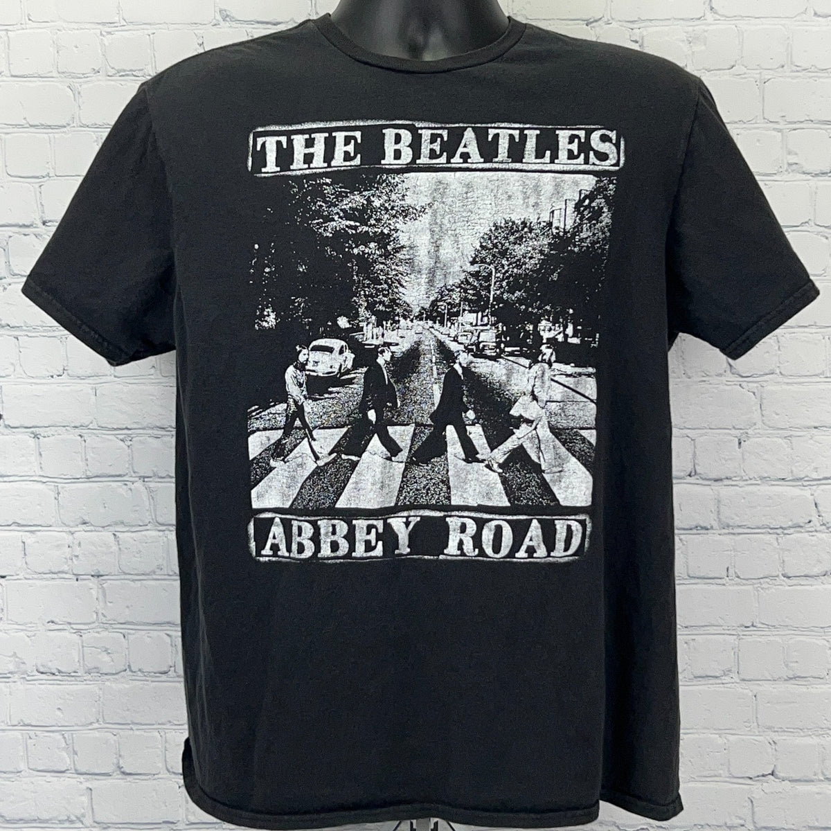 Black The Beatles Abbey Road T-shirt featuring iconic album cover art in front view