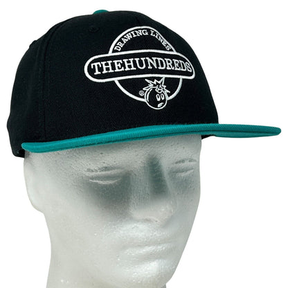 Front view of The Hundreds black cap with turquoise brim and logo detailing