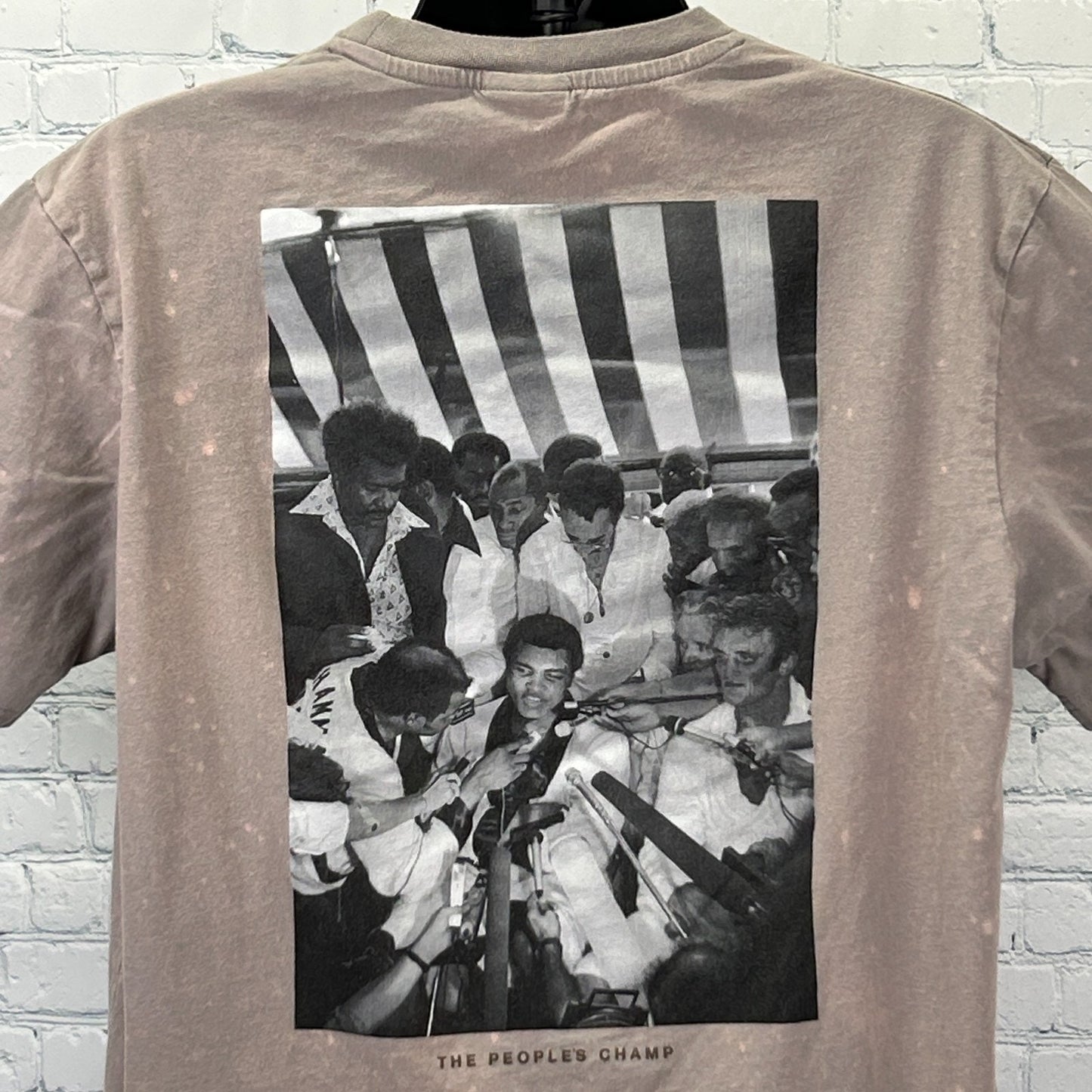 Muhammad Ali T Shirt in taupe color featuring a large black and white photo on the back