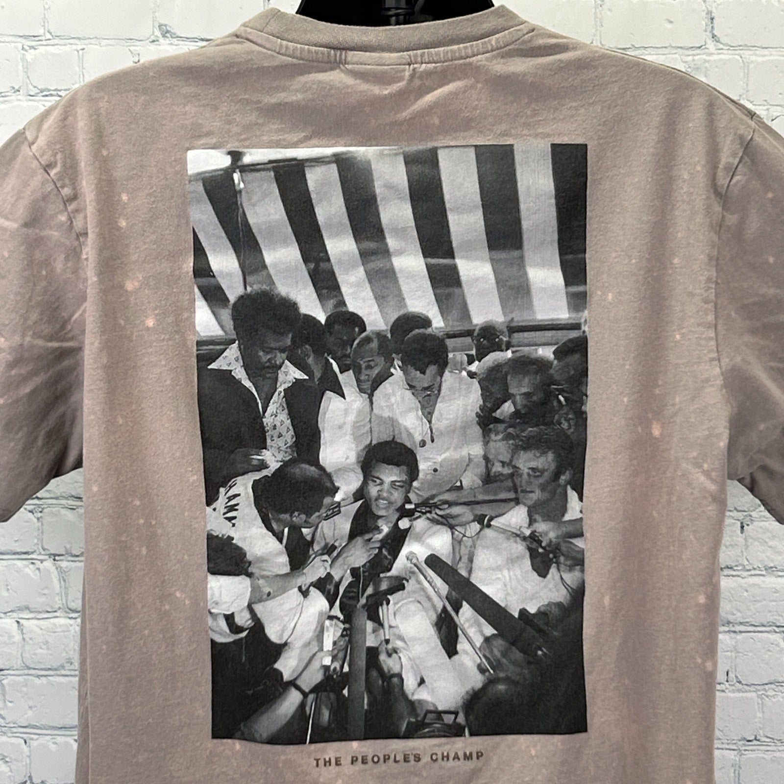 Muhammad Ali T Shirt in taupe color featuring a large black and white photo on the back