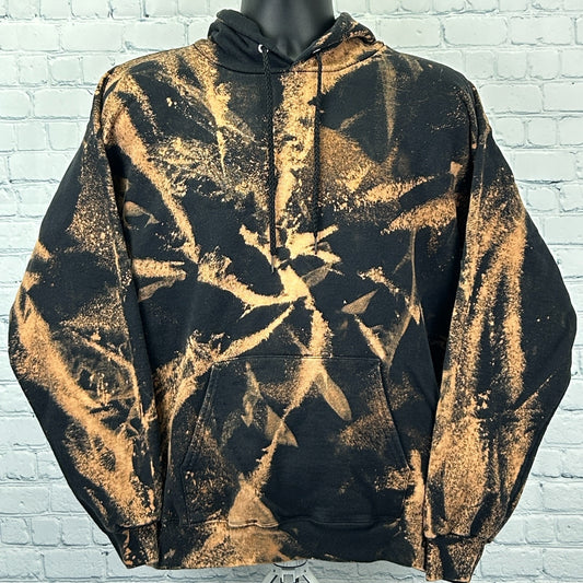 Hanes Tie Dye Hoodie in black and orange with a front view, featuring a unique abstract pattern