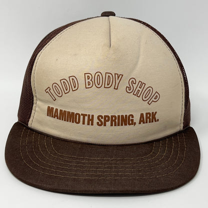 Brown and beige Trucker Hat featuring Todd Body Shop logo from Mammoth Spring, AR, view from the front