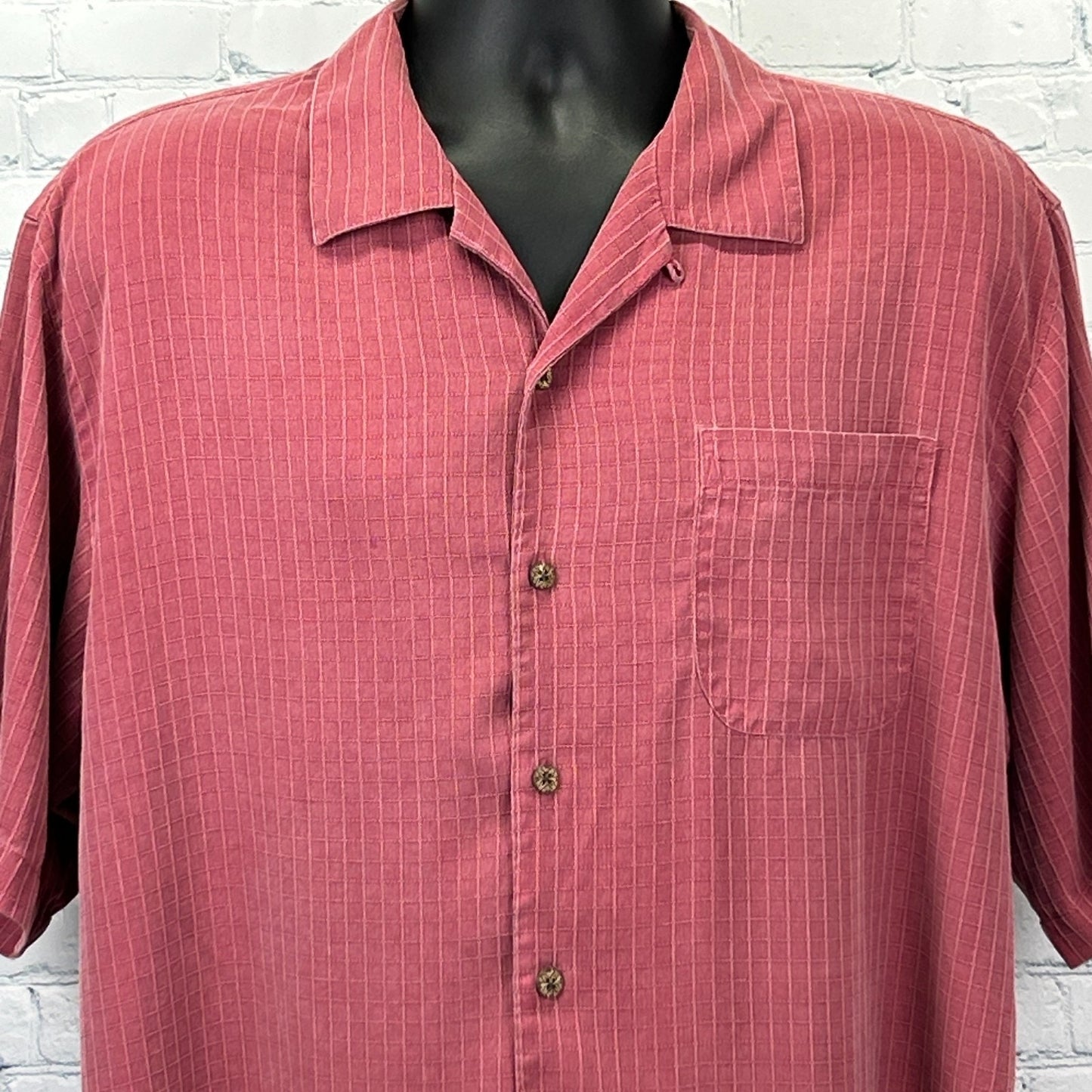 Tommy Bahama Hawaiian Shirt in coral with vertical stripes, featuring a chest pocket and front button closure