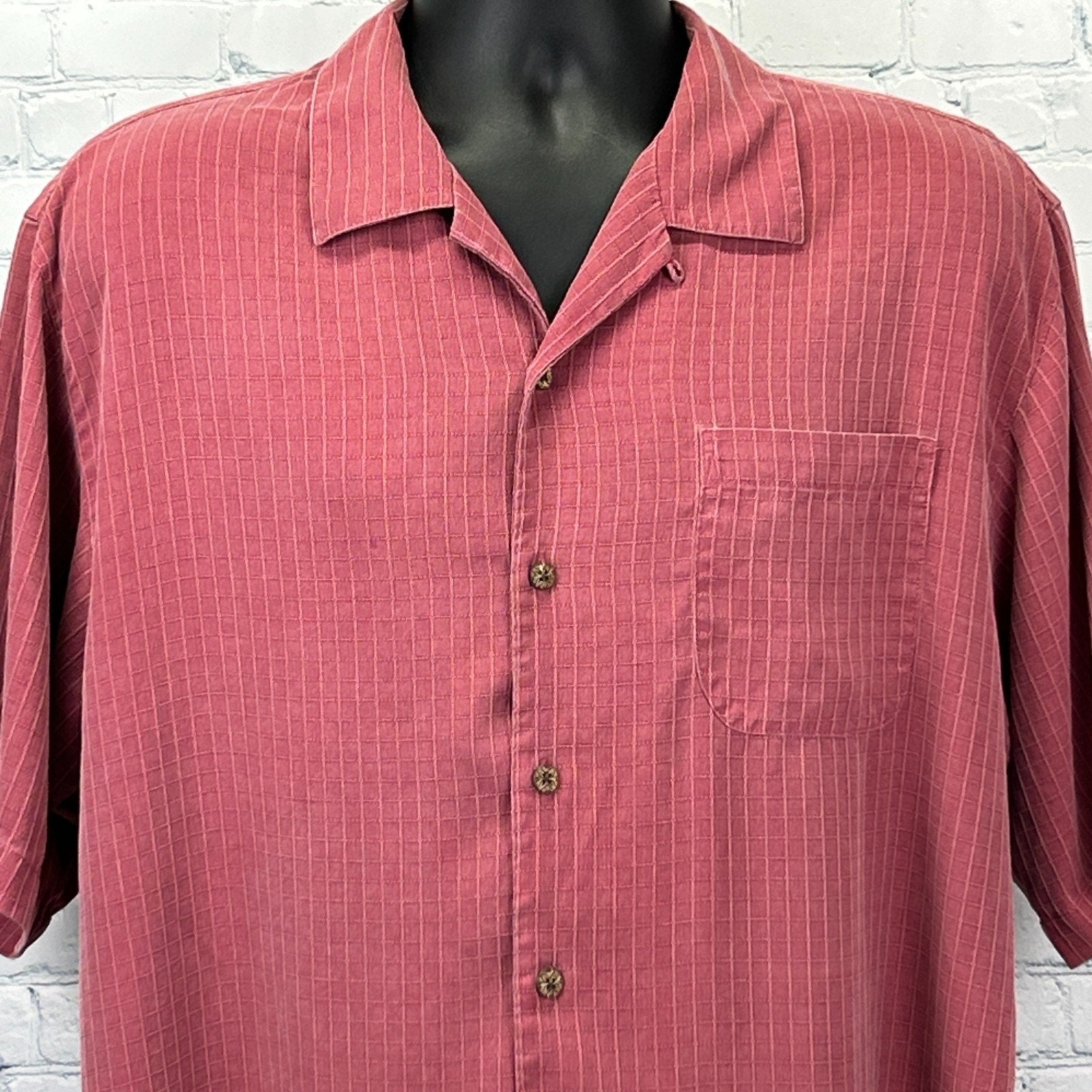 Tommy Bahama Hawaiian Shirt in coral with vertical stripes, featuring a chest pocket and front button closure