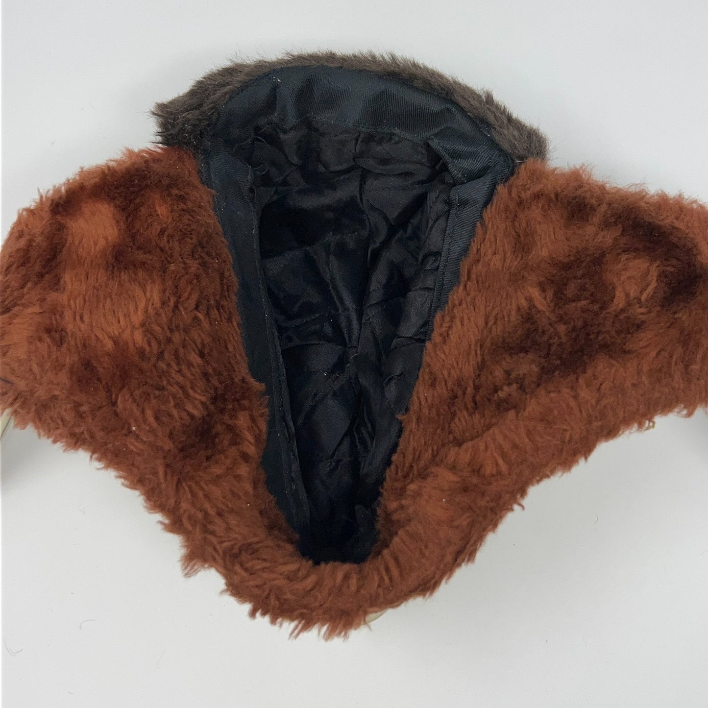 Vintage brown trapper hat from the 1980s, front view, fur-lined for warmth