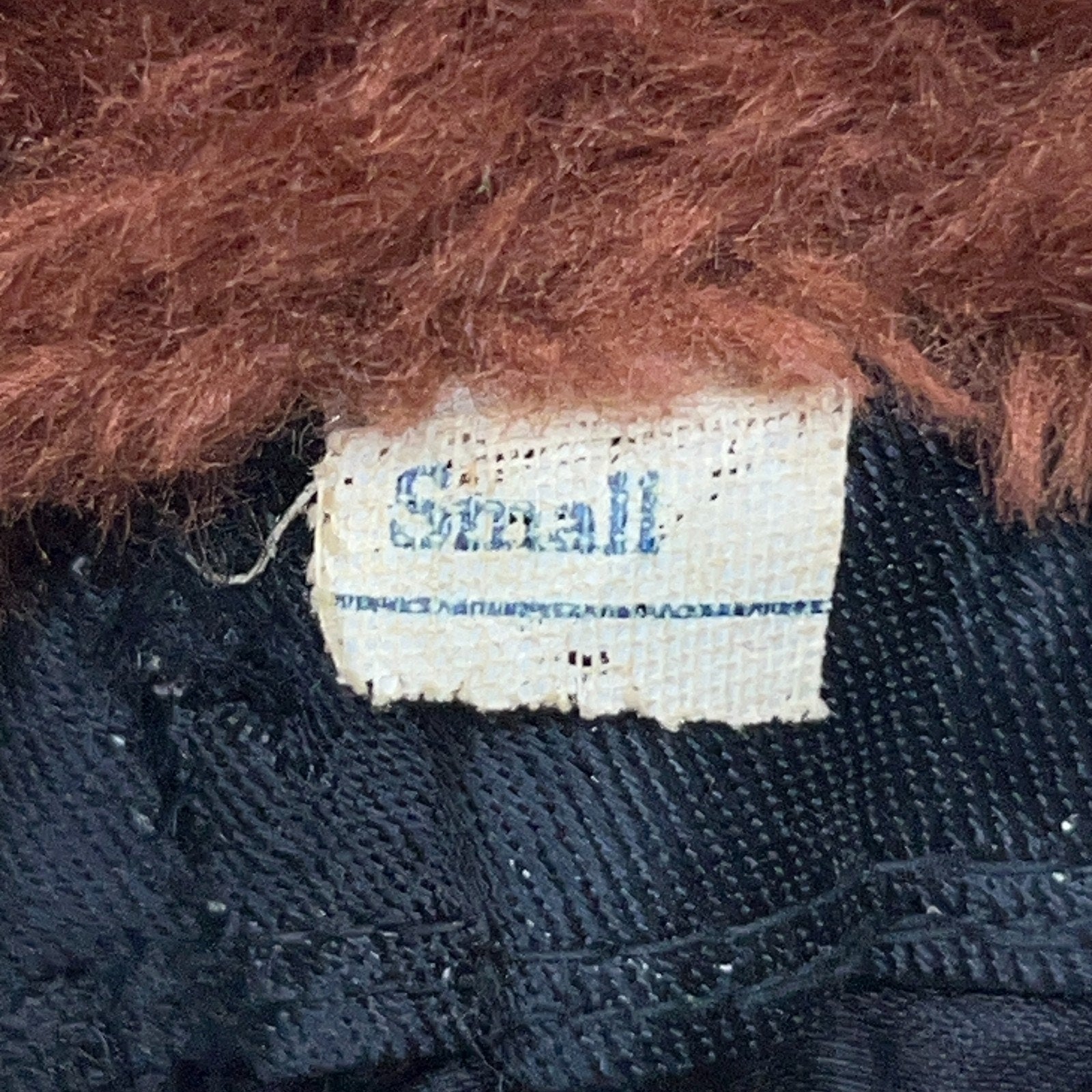 Vintage trapper hat in brown, small size, featuring a soft fur exterior and classic design