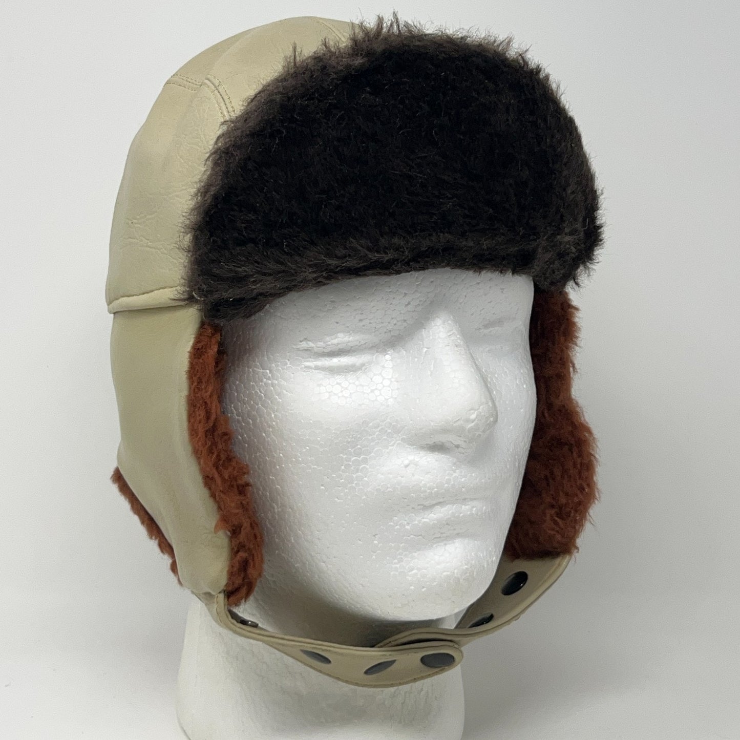 Vintage 1980s tan trapper hat with brown fur lining and ear flaps, front view