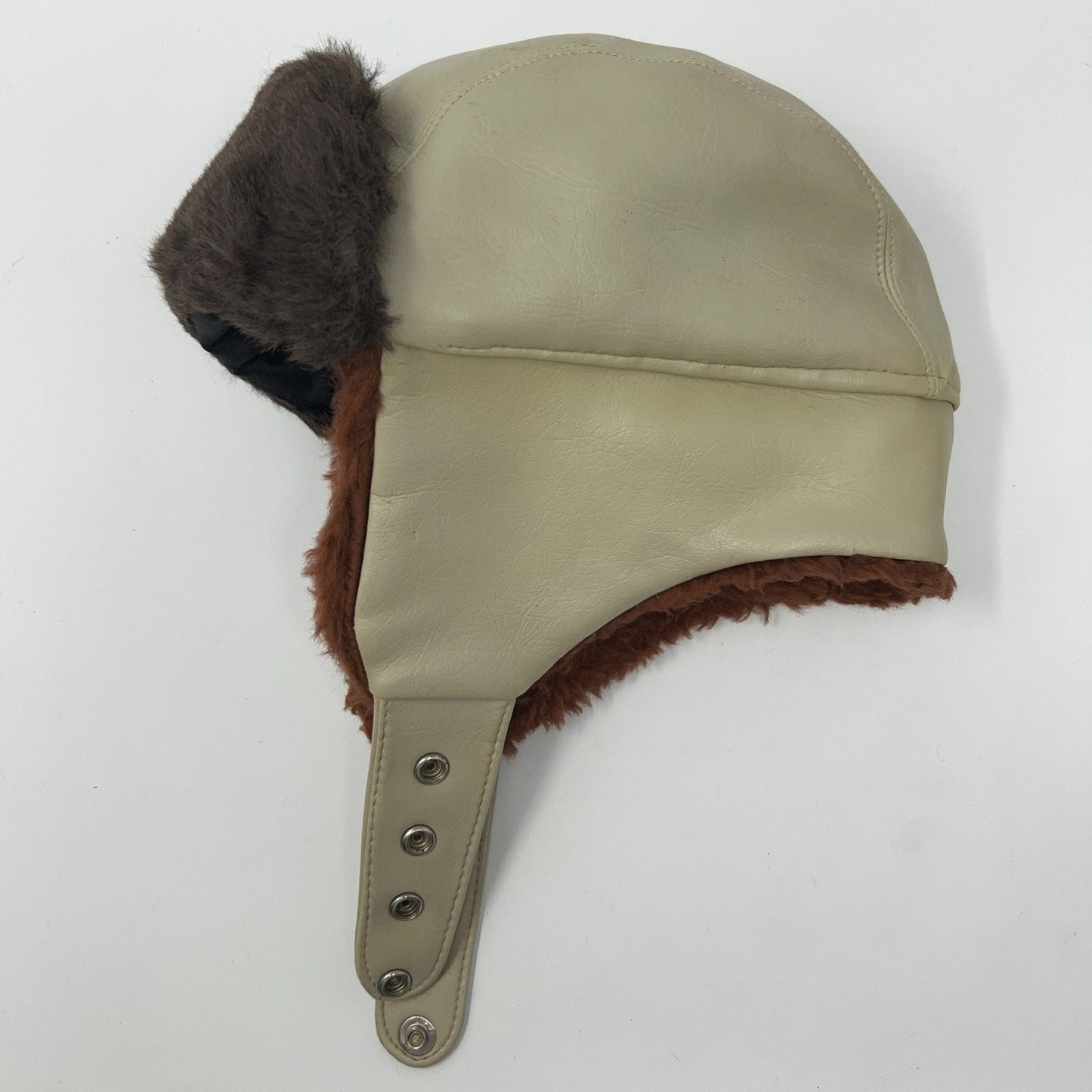 Vintage 1970s beige trapper hat with faux fur and ear flaps, side view, adult size