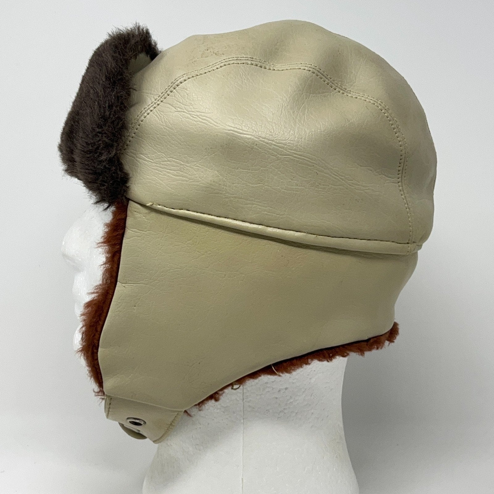 Vintage trapper hat in beige leather with faux fur trim, side view