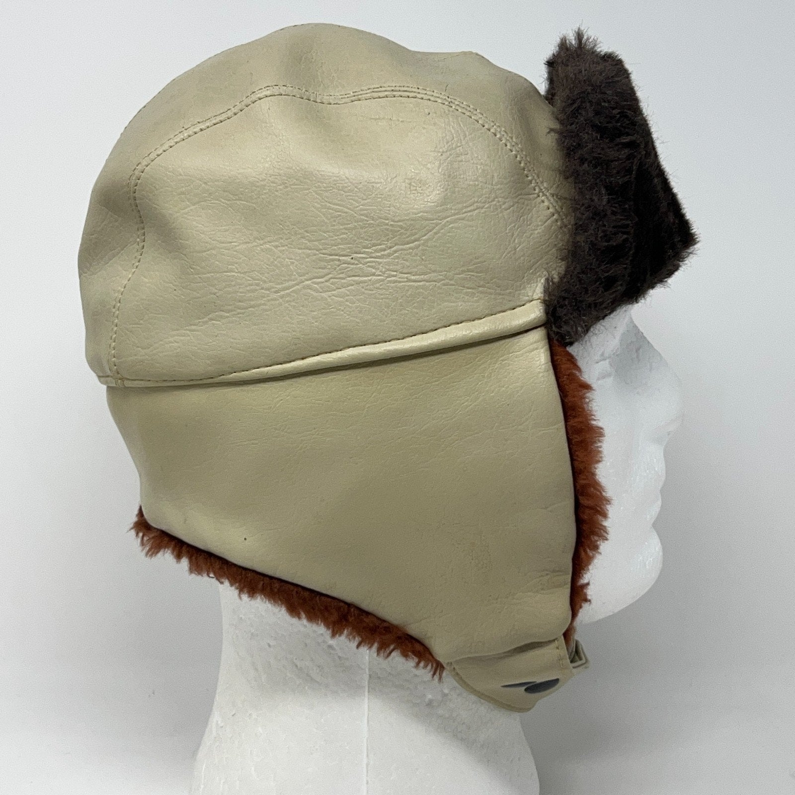 Vintage 1980s beige trapper hat with faux fur ear flaps, side view