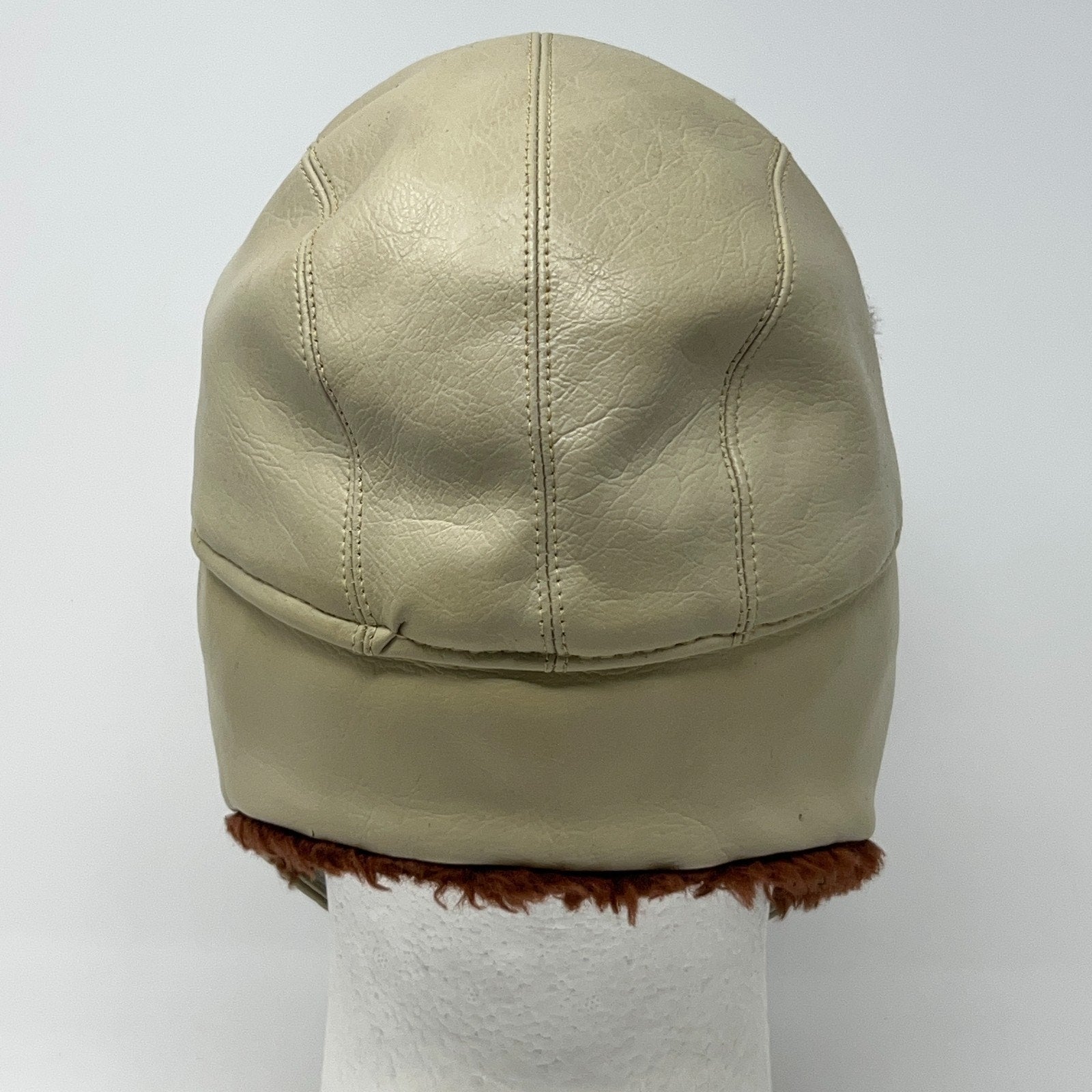 Vintage 1980s beige trapper hat in medium size, shown from the back with faux fur trim