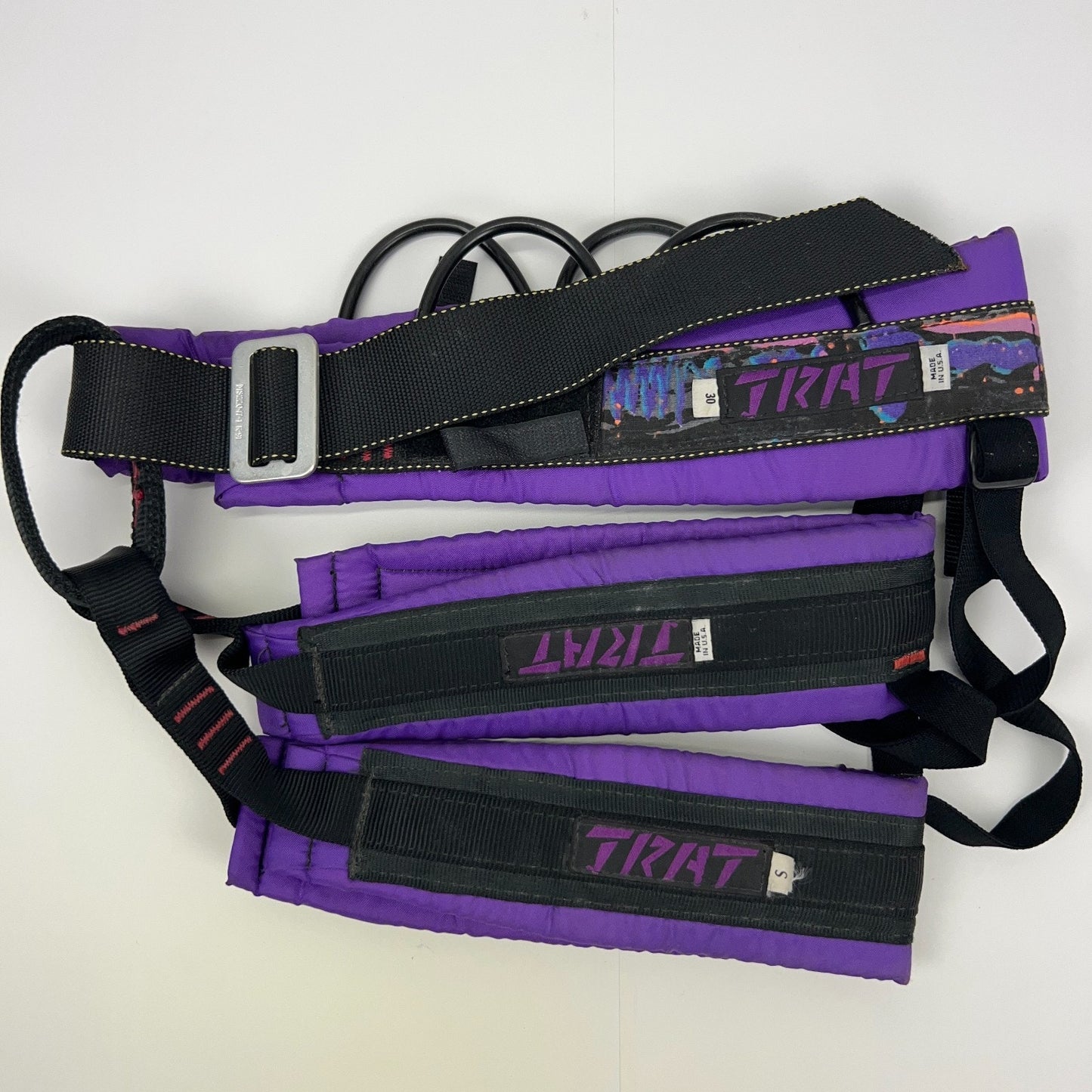 JRAT Climbing Harness in purple with padded support, detailed straps, and logo for stability during climbs