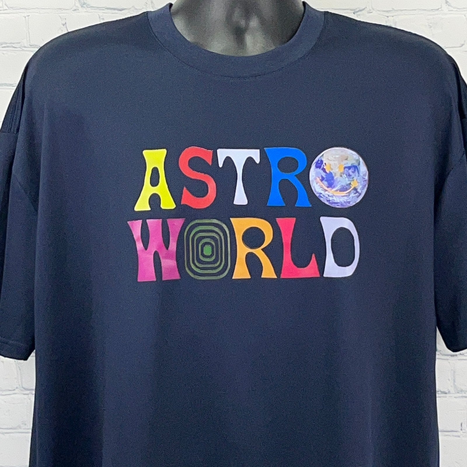 Unbranded navy t-shirt featuring Travis Scott Astroworld graphic on the front with colorful lettering