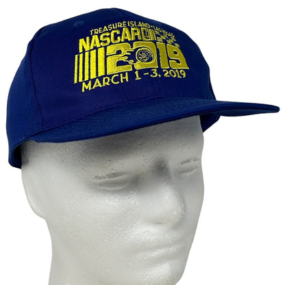 Navy blue Hit Wear NASCAR cap featuring the Treasure Island logo and event dates embroidered on the front