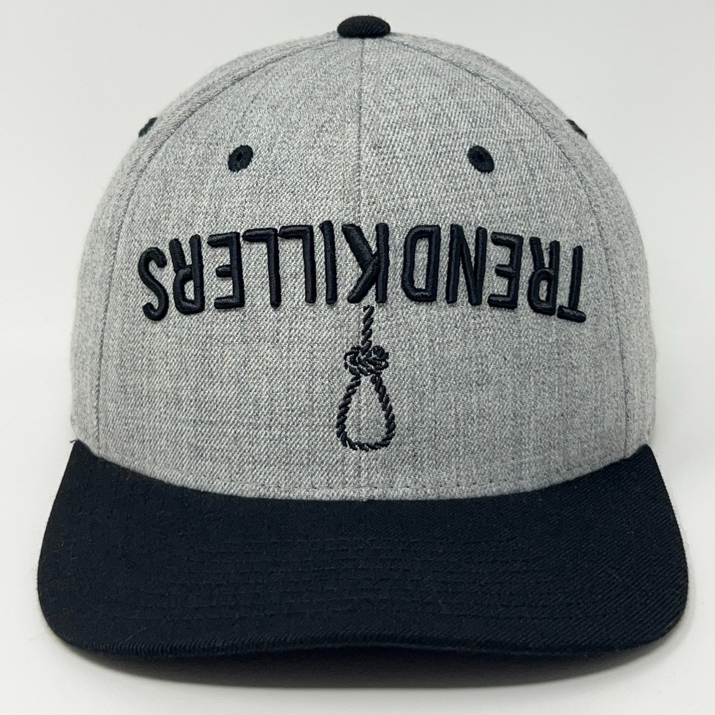 Front view of a gray Trend Killers cap with black brim and unique logo detail