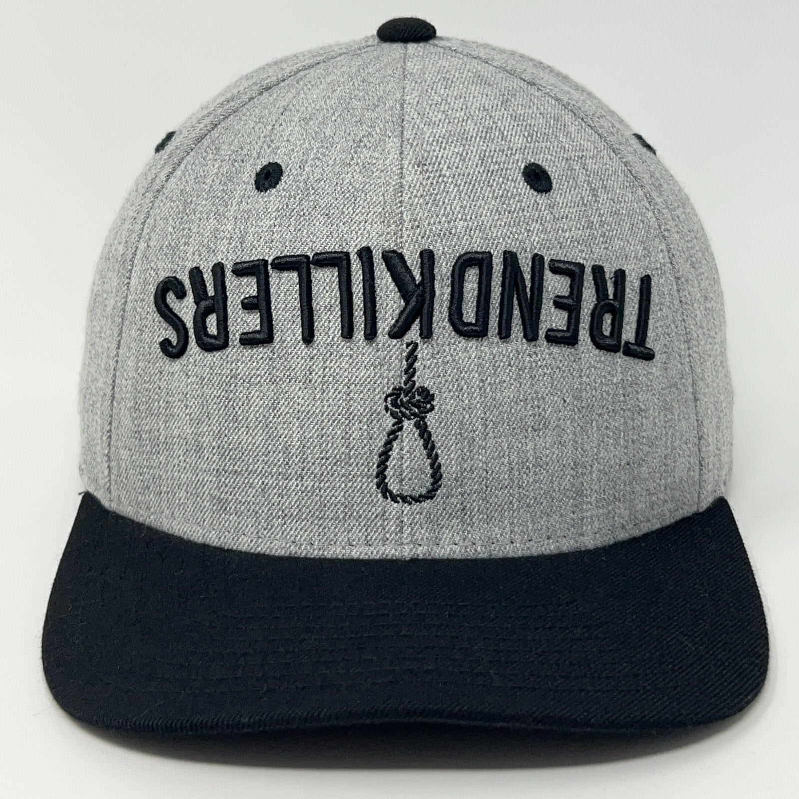 Front view of a gray Trend Killers cap with black brim and unique logo detail