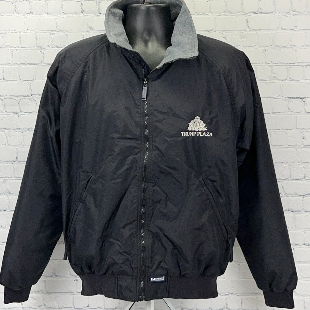 Vintage black Trump Plaza Atlantic City bomber jacket with gray collar for stylish retro wear