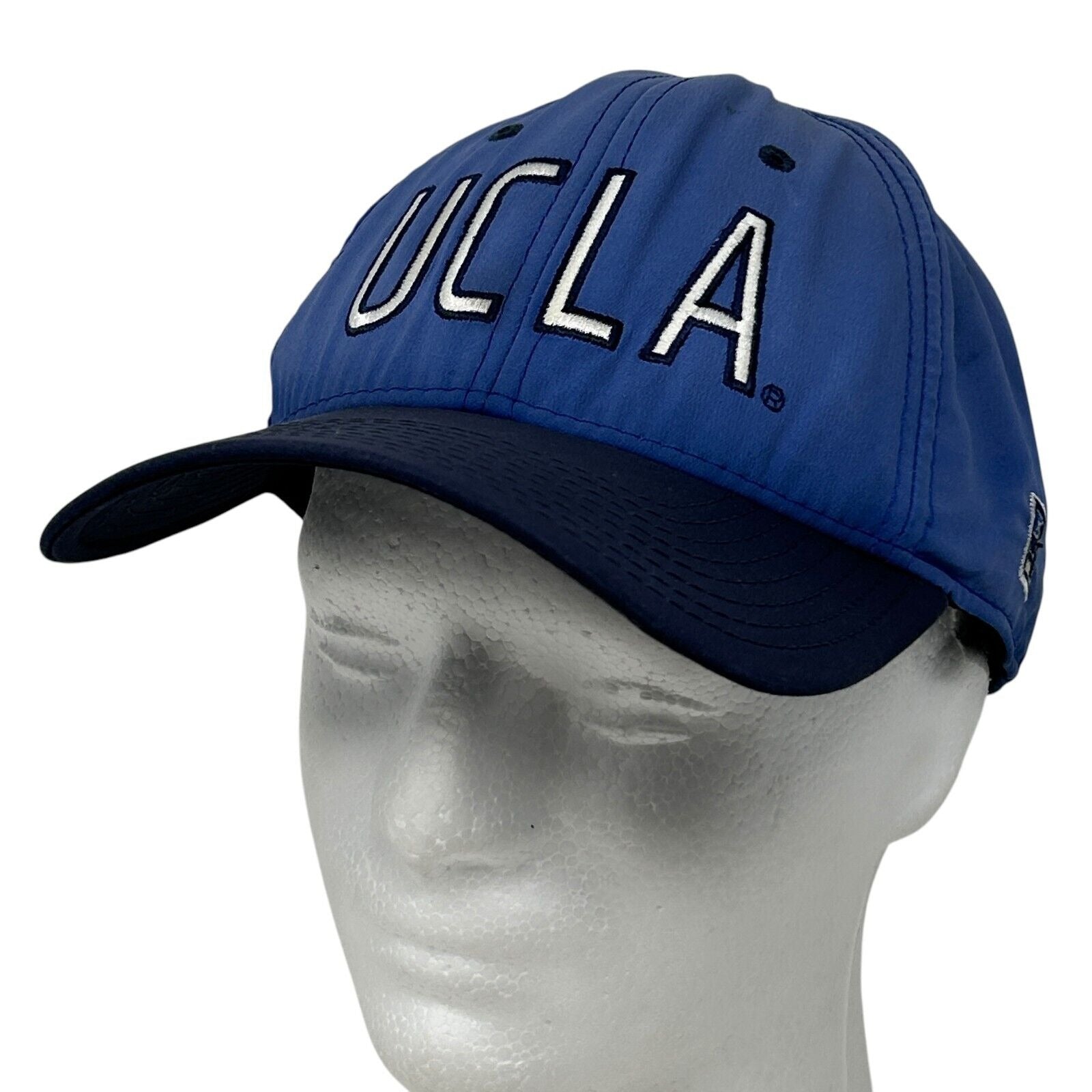 Blue UCLA hat with embroidered letters and a curved brim, front view for sports fans