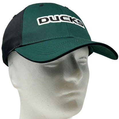 Front view of green and black Captivating Headwear cap featuring University of Oregon Ducks logo in white