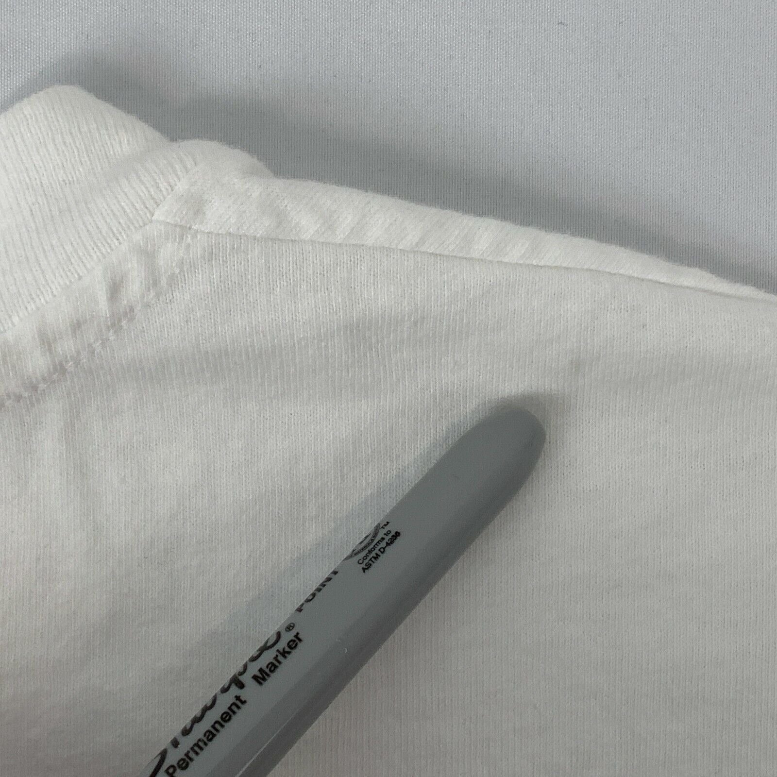 Detail of Hanes white T-shirt collar showing soft fabric, ideal for Las Vegas trips