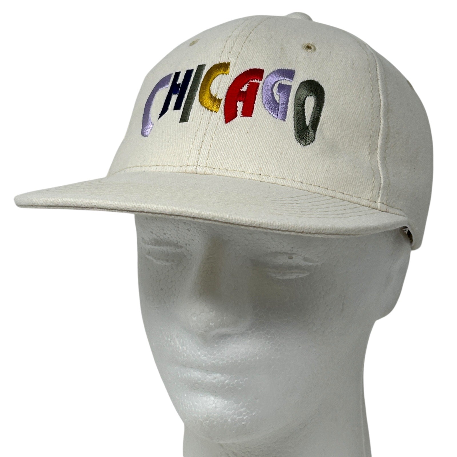 Vintage Chicago baseball cap in beige with multi-colored embroidered lettering on the front.
