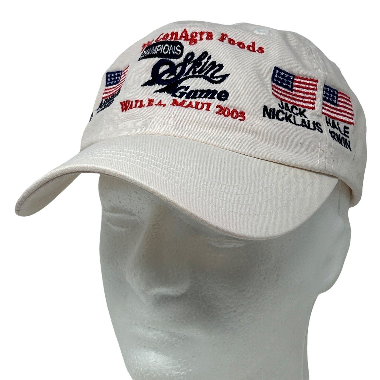 White Imperial golf cap with embroidered USA flags and text from the 2003 Champions Skin Game