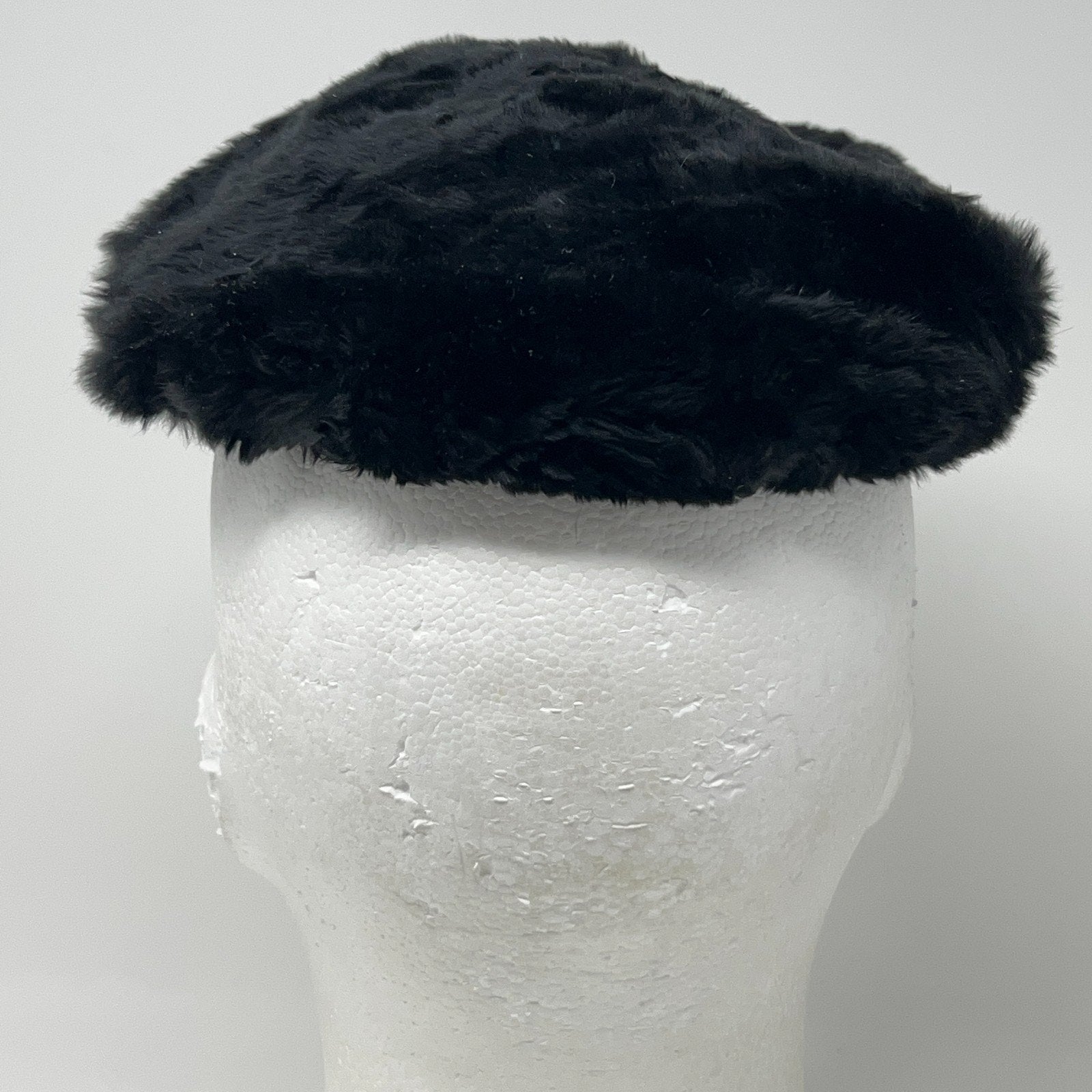 Saks Fifth Avenue black pillbox hat in vintage style, viewed from the front