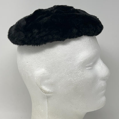 Saks Fifth Avenue vintage black pillbox hat displayed on a mannequin head, side view