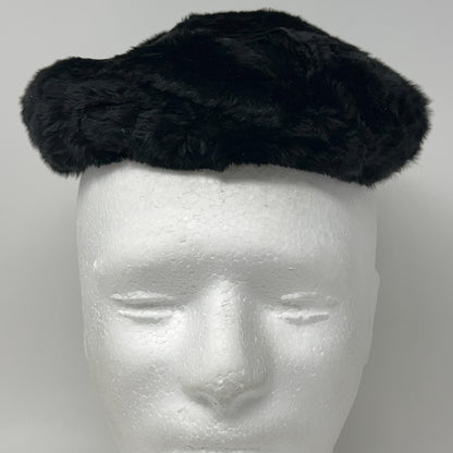 Saks Fifth Avenue black pillbox hat from the 1960s, shown from the front on a mannequin