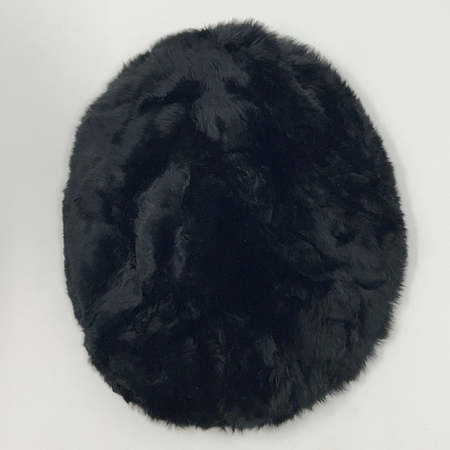 Saks Fifth Avenue black pillbox hat from the 2020s, viewed from the top