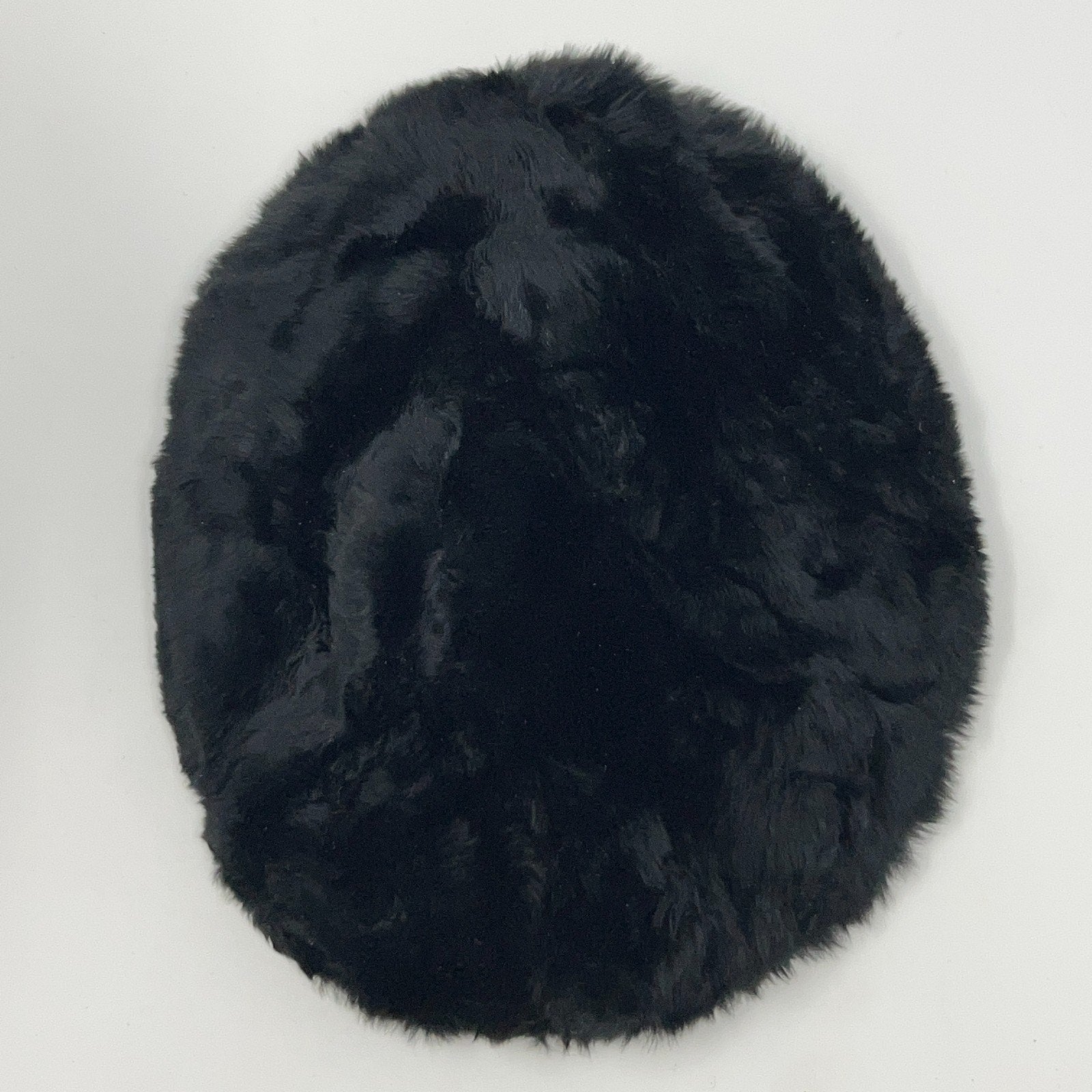 Saks Fifth Avenue black pillbox hat from the 2020s, viewed from the top